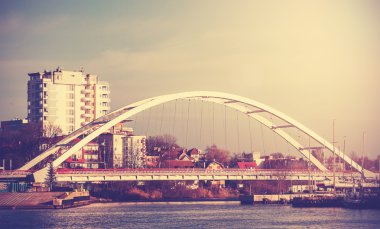 Retro vintage filtered picture of a bridge in Kolobrzeg, Poland. clipart
