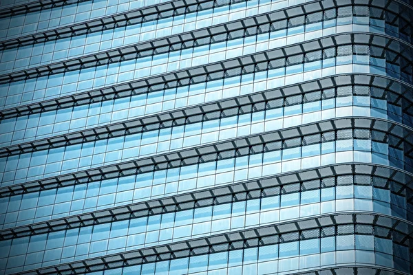Blauwe abstracte achtergrond, glas en staal van moderne gebouw. — Stockfoto