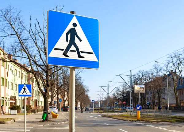 Pedestrian crossing signs on the street.