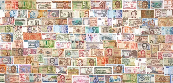 Billetes de todo el mundo superpuestos entre sí . — Foto de Stock
