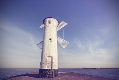 Old windmill lighthouse in Swinoujscie, Poland. clipart