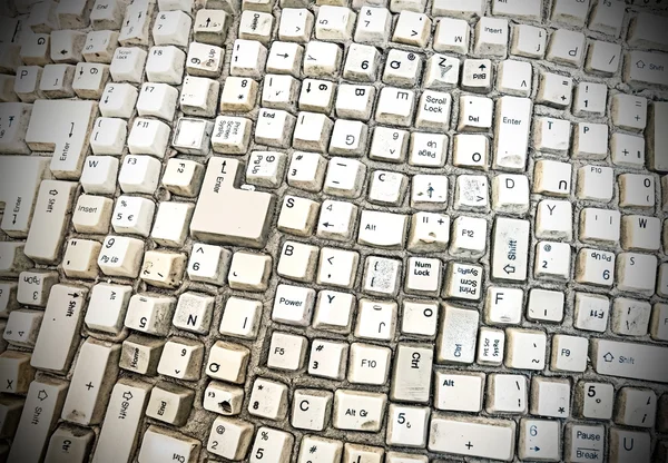 Grungy fondo abstracto hecho de teclas de teclado de ordenador . — Foto de Stock