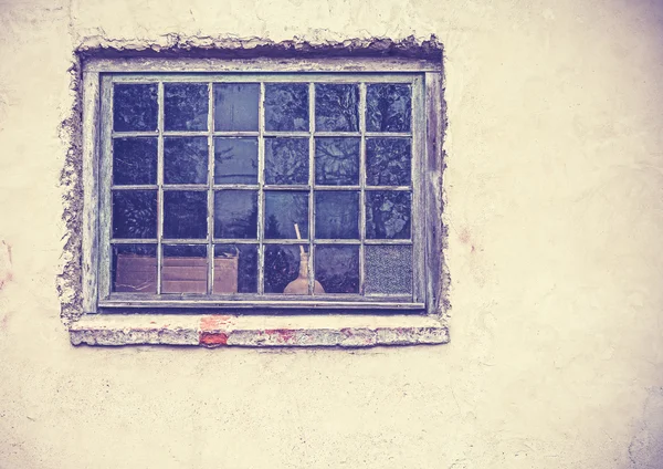 Old grungy window on an old dirty wall. — Stock Photo, Image