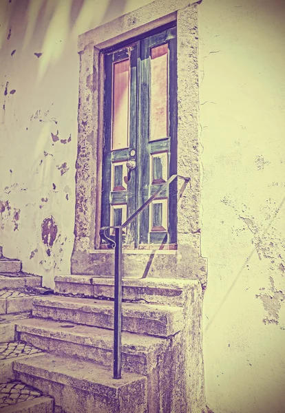 Retro filtered picture of old wooden front door. — Stock Photo, Image