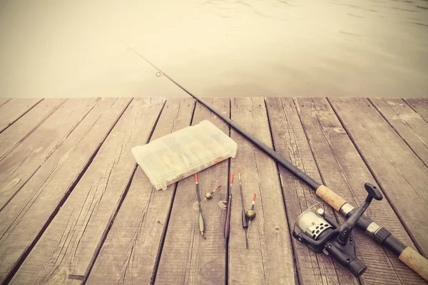 Retro tonas bild av fiskeutrustning. — Stockfoto