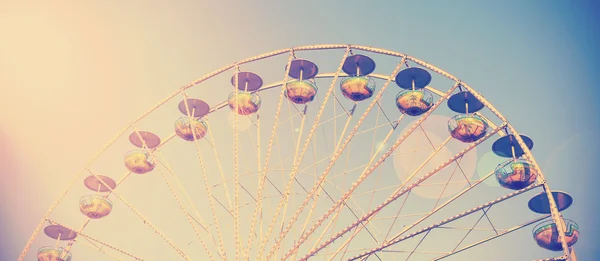 Vintage filtered picture of a carousel at sunset. — Stock Photo, Image