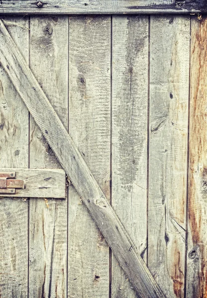 Old grungy wooden barn door. — Stock Photo, Image