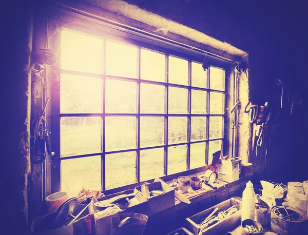 Vintage stylized window in carpenter's workshop. — Stock Photo, Image