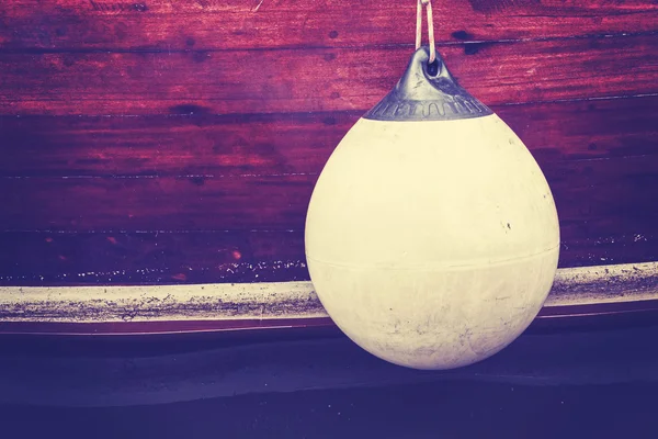 Rubber buoy, vintage toned concept photo. — Stockfoto