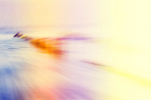 Motion blurred abstract background, wooden posts on beach. — Stock Photo, Image