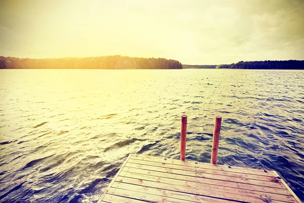 Vintage instagram filtered wooden pier at sunset. — Stock Photo, Image