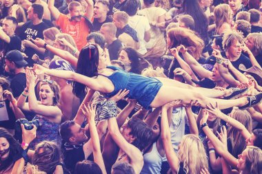 People having fun during concert on the 21th Woodstock Festival Poland. clipart