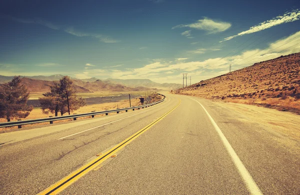 Retro old film style country highway in USA. — Stock Photo, Image