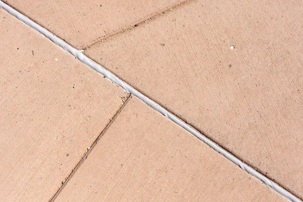 A beton járda, rendszeres vonalakkal készült háttér. — Stock Fotó
