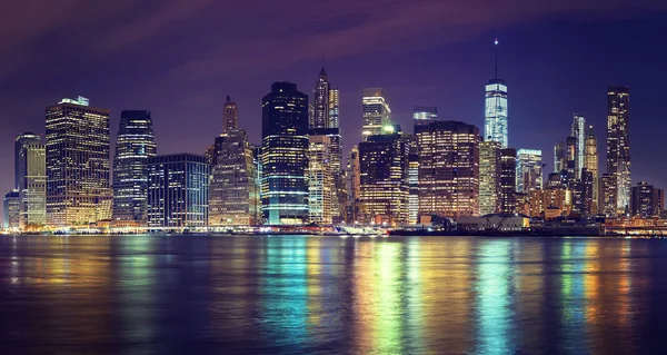 Vintage toned Manhattan skyline at night, NYC, USA. — Stock Photo, Image
