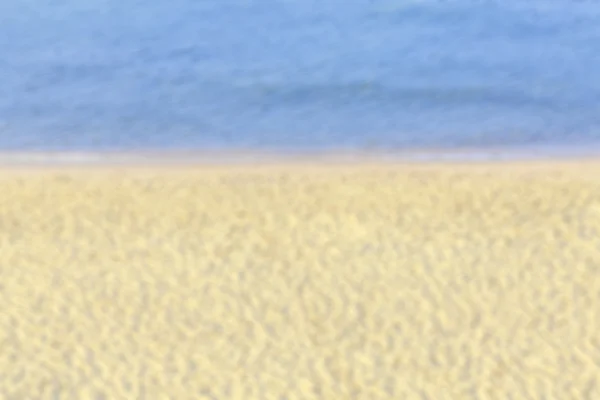 Verschwommenes Bild eines Strandes, abstrakter Hintergrund oder Textur — Stockfoto