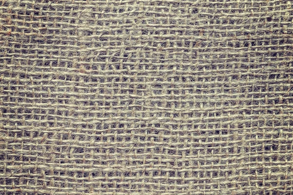 Винтажный тонизированный крупным планом рисунок натуральной джутовой ткани — стоковое фото