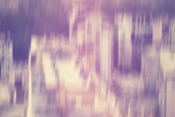 Purple vintage toned motion blurred urban background — Stock Photo, Image