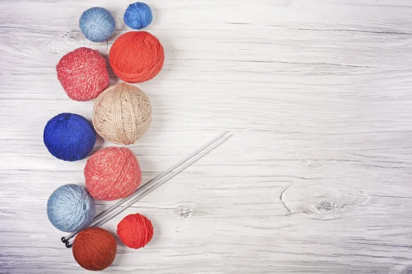 Vintage toned yarn balls on wooden boards. — Stock Photo, Image