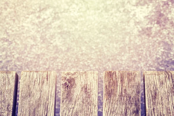 Vintage toned old wooden pier on ice, space for text. — Stock Photo, Image