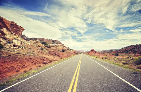 Vintage stylized photo of a scenic desert road, USA — Stock Photo, Image