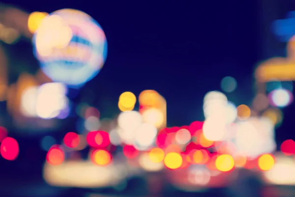 Retro toned blurred street lights, urban abstract background. — Stock Photo, Image