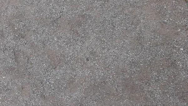 The texture of the surface with crushed stone. Stone crumb.