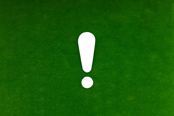 White exclamation mark on a green background. Drawing attention.