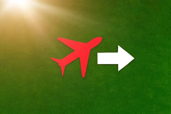 The plane is red, the arrow pointer is white on a green background. Business class, air travel, business trips.