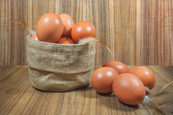 Eggs in basket on wood.eggs.egg.brown.rawfood — Stock Photo, Image