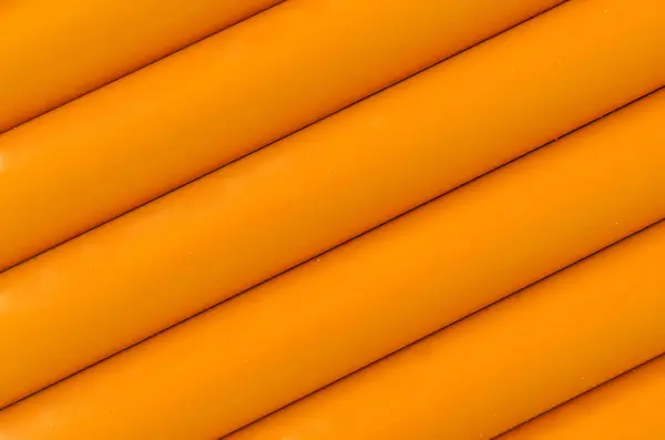 Orange plastic tubing pattern texture background — Stock Photo, Image