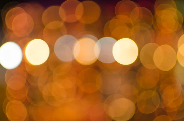 Noční světlo červeno oranžové světlé bokeh pozadí — Stock fotografie