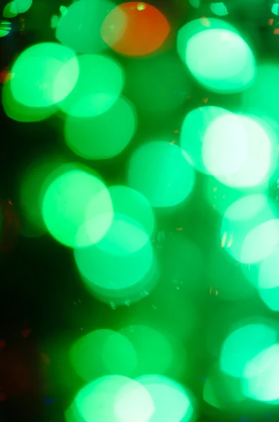 Noční světlo zelené světlé bokeh pozadí — Stock fotografie