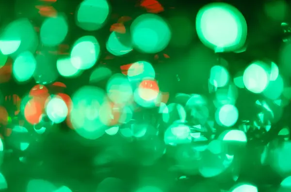 Noční světlo zelené světlé bokeh pozadí — Stock fotografie