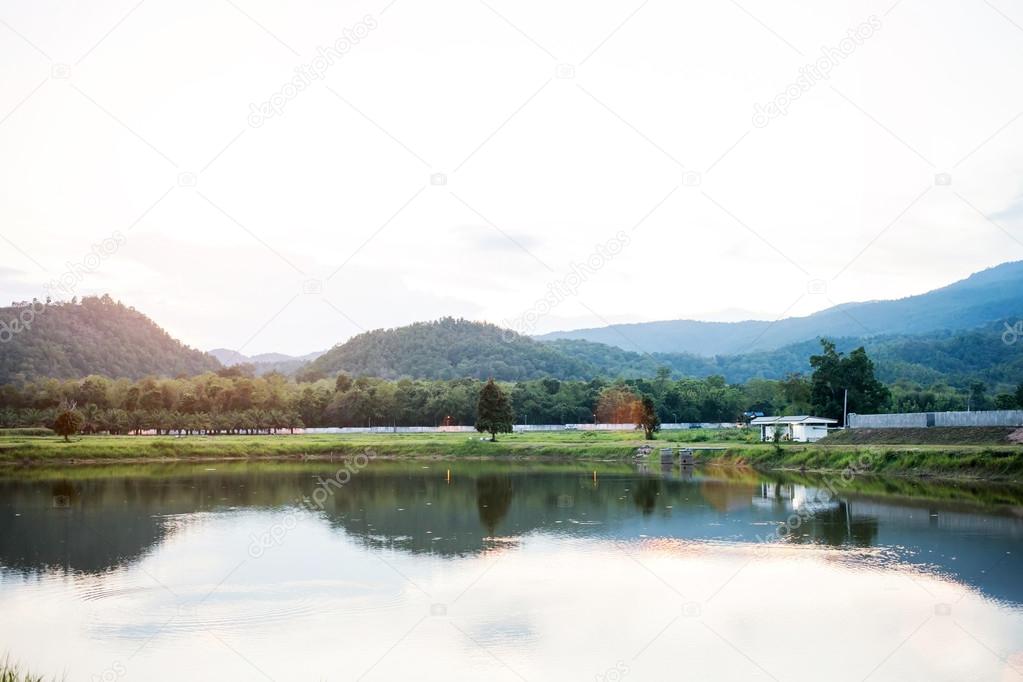 Landscape and Reflection of nature in the river at evening