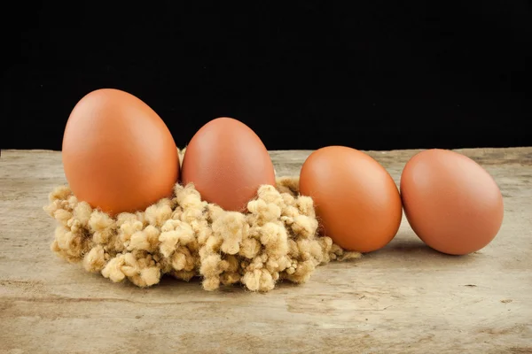 Fresh brown eggs on wood background — Stock Photo, Image