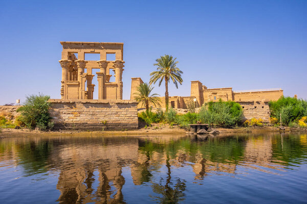 The beautiful temple of Philae and the Greco-Roman buildings seen from the Nile river, a temple dedicated to Isis, goddess of love. Aswan. Egyptian