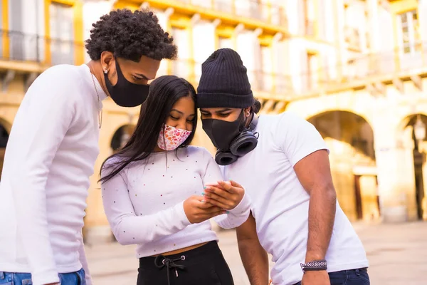 Lifestyle Latino Friends Having Fun Face Masks Looking Something Phone — Stock Photo, Image