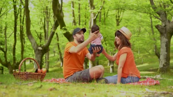 Family Picnic Day Playing Newborn Son Dressed Orange Shirts Hats — Stock Video