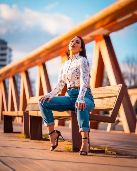 Brunette Latin Girl Jeans City Sunset Orange Jumper Posing Seated — Stock Photo, Image