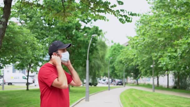 Young Man Red Shirt Removing His Surgical Mask End Coronavirus — Stok video
