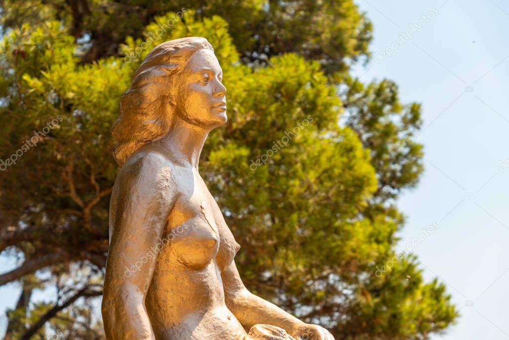 Mermaid sculpture in Cala Canyet next to the town of Tossa de Mar. Girona, Costa Brava in the Mediterranean