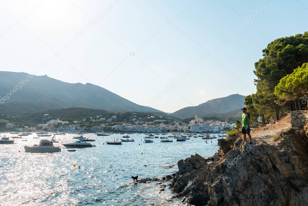 A young man on summer vacation in Cadaques by the sea, Costa Brava of Catalonia, Gerona, Mediterraneo. Spain