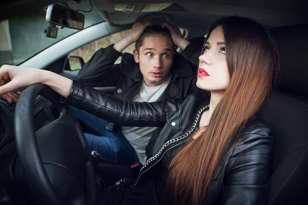 Couple quarrel in the car,  woman behind wheel of  car — Stock Photo, Image