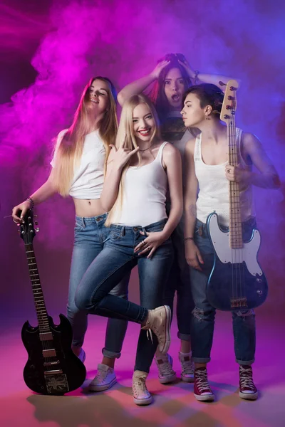 Music female artist, 4 beautiful girls, style, jeans, youth — Stok fotoğraf