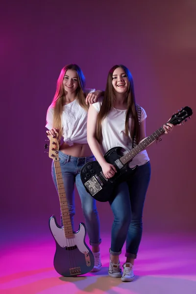 two girls with musical instruments, music female artist.
