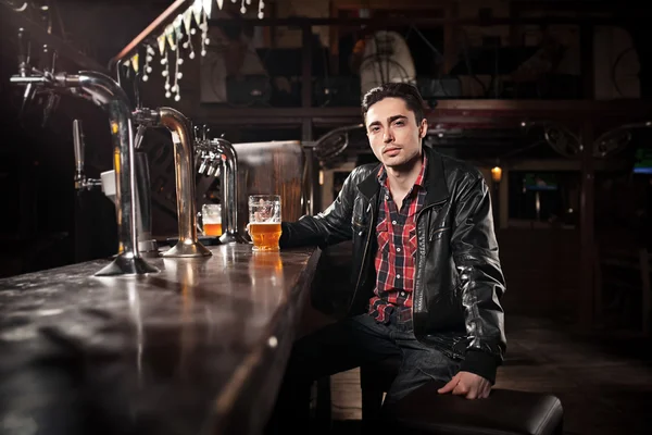 Was a hard day. Depressed  man drinking beer in bar — Stock Photo, Image