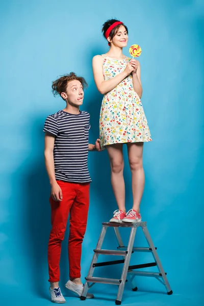 Man and woman fighting for a sweets. — Stock Photo, Image