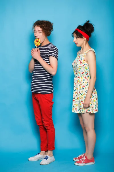 Man and woman fighting for a sweets. — Stock Photo, Image