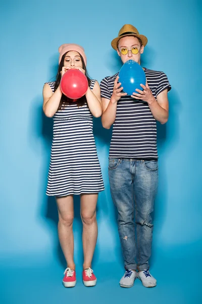 Funny couple in love with balls  the studio — Stock Photo, Image